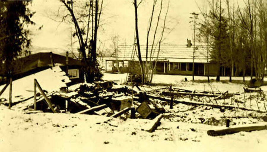 Reminsence of the Idaho Inn after its fire in Coolin, Idaho. The restaurant can be seen in the background. Donated by Marjorie Paul Roberts via Priest Lake Museum.