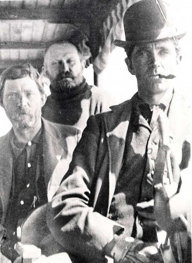 Portrait of Walter W. Slee, Harry Bear, and 'Windy Bill' aboard a boat. Donated by Marjorie (Paul) Roberts through Priest Lake Museum.