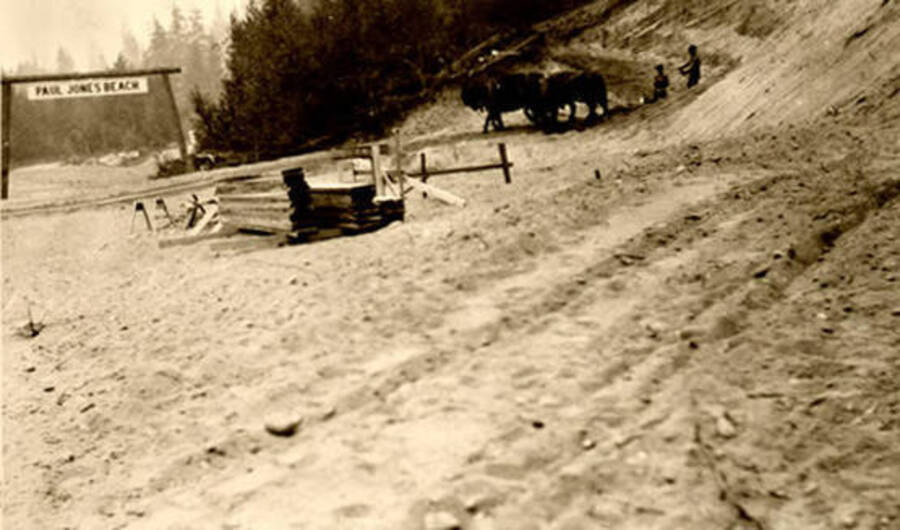 A team of horses digging out the hill for a new Leonard Paul store. Coolin, Idaho. Donated by Marjorie Paul Roberts via Priest Lake Museum.