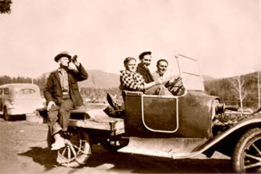 Temp Kerr, Scotty Winslow, Leo Bruno and Staton Finch posing in an automobile in Nordman, Idaho. The Brunos came to Nordman in October 1946. Donated by Dorothy Bruno through Priest Lake Museum.