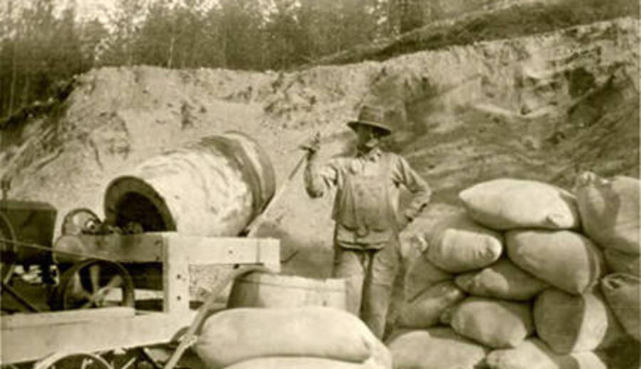 A worker mixing cement for the new Leonard Paul store in Coolin, Idaho. Donated by Marjorie Paul Roberts via Priest Lake Museum.