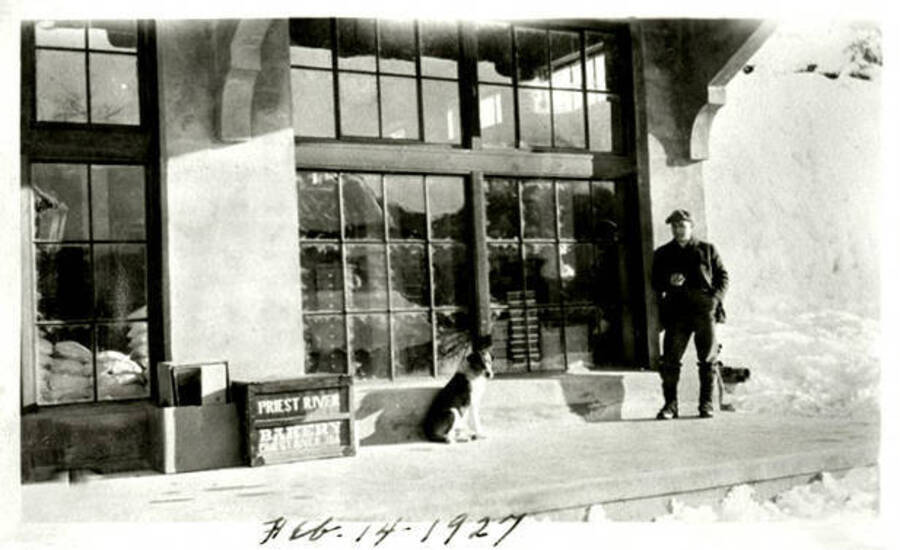 Leonard Paul standing on the porch of his store. Coolin, Idaho. Donated by Marjorie Paul Roberts via Priest Lake Museum.