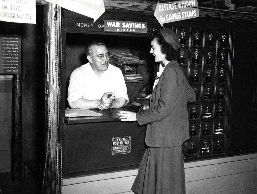 Leonard Paul with a patron at the Post Office in Coolin, Idaho. Donated by Marjorie (Paul) Roberts through Priest Lake Museum.