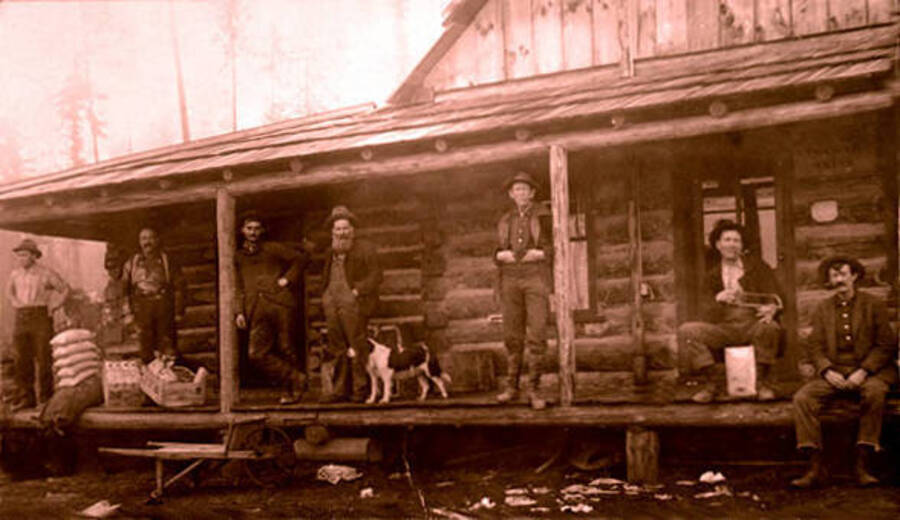 Exterior view of Leonard Paul's general store. Paul shown at far left, Fred Chant standing center. Coolin, Idaho. Donated by Marjorie Paul Roberts via Priest Lake Museum.