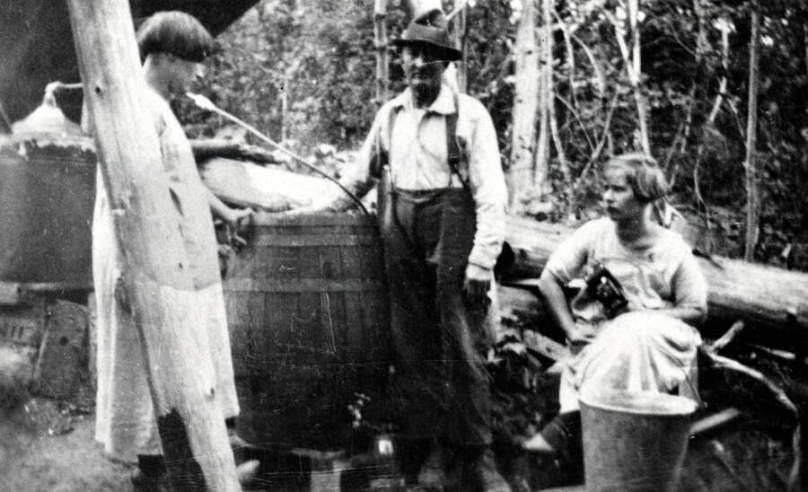Pete Chase and two others at his moonshine still.