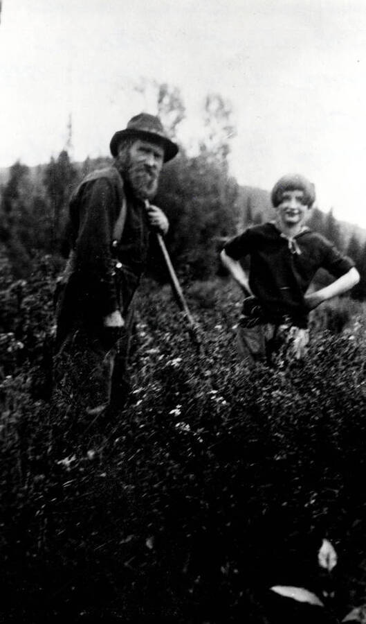 Gustav 'Cougar Gus' Johnson and Ruth Scott standing in a field.