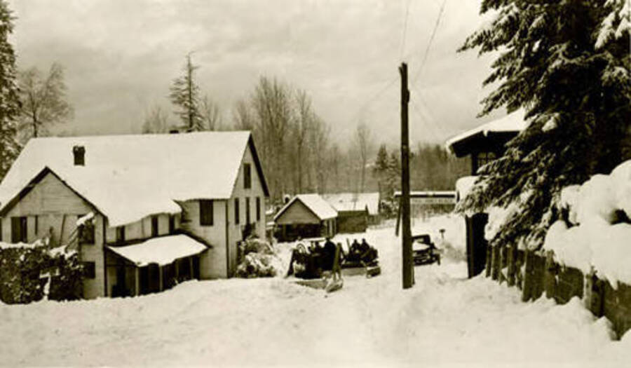 Plowing snow on main street in Coolin, Idaho. Donated by June Paul Paley through Priest Lake Museum.