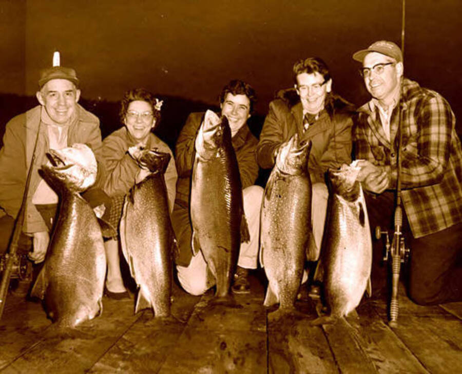 Five people posed with Mackinaw trout. Donated by Russ Bishop through Priest Lake Museum.