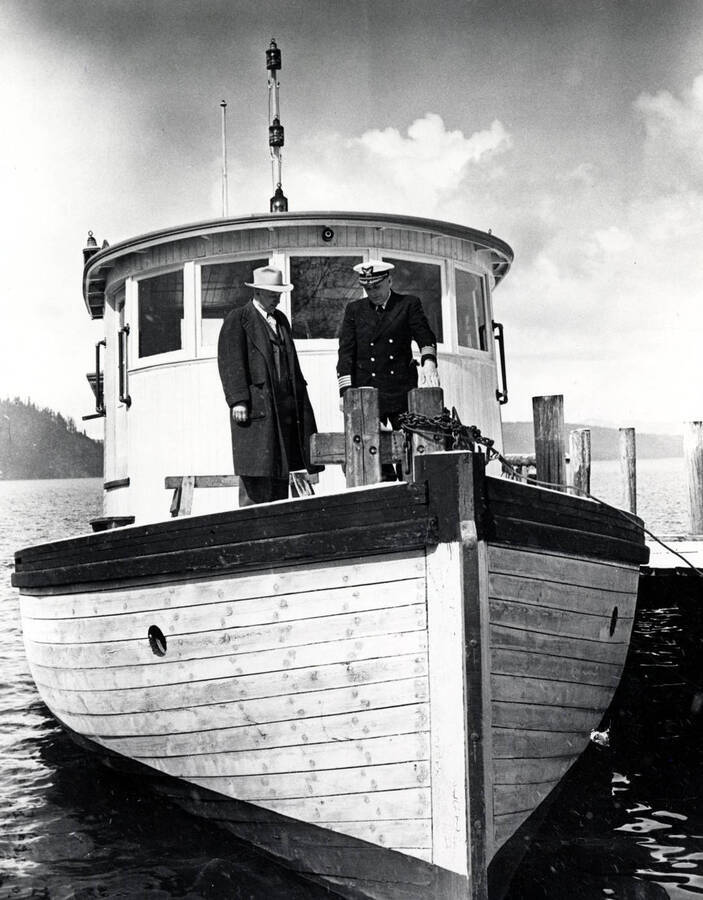 Captain R.E. Boombs and E.J. Elliott on the deck of the steamboat Tyee.