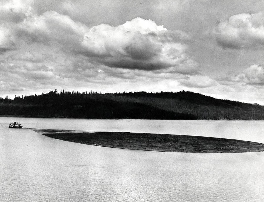 View of steamboat Tyee pulling a log boom on Priest Lake, Idaho. Donated by Russ Bishop through Priest Lake Museum.