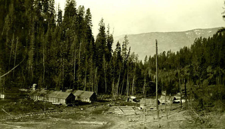 View of a camp with railroad tracks running through it. Donated by Viv Beardmore through Priest Lake Museum.