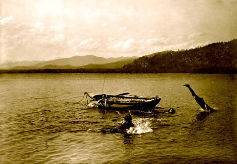 A person jumping out of a boat at Priest Lake, Idaho. Donated by Viv Beardmore through Priest Lake Museum.
