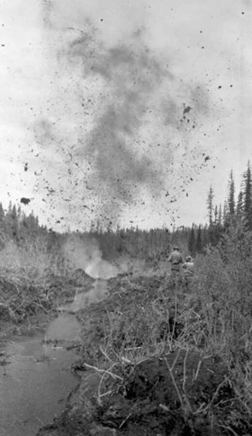 Workers blasting a creek in Hughes Meadow. Donated by Red Gasterneau through Priest Lake Museum.