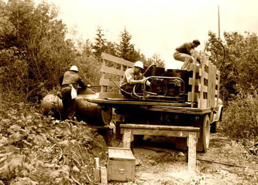 Workers mixing solution near Bear Creek, Idaho. Donated by Red Gasterneau through Priest Lake Museum.