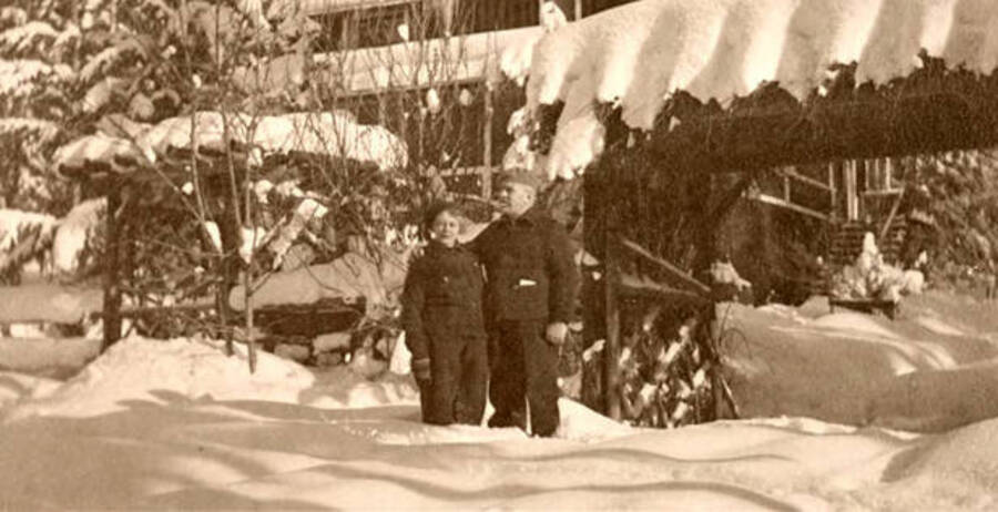Leonard Paul and Vera standing in front of home during winter. Coolin, Idaho. Donated by Harriet (Klein) Allen via Priest Lake Museum.