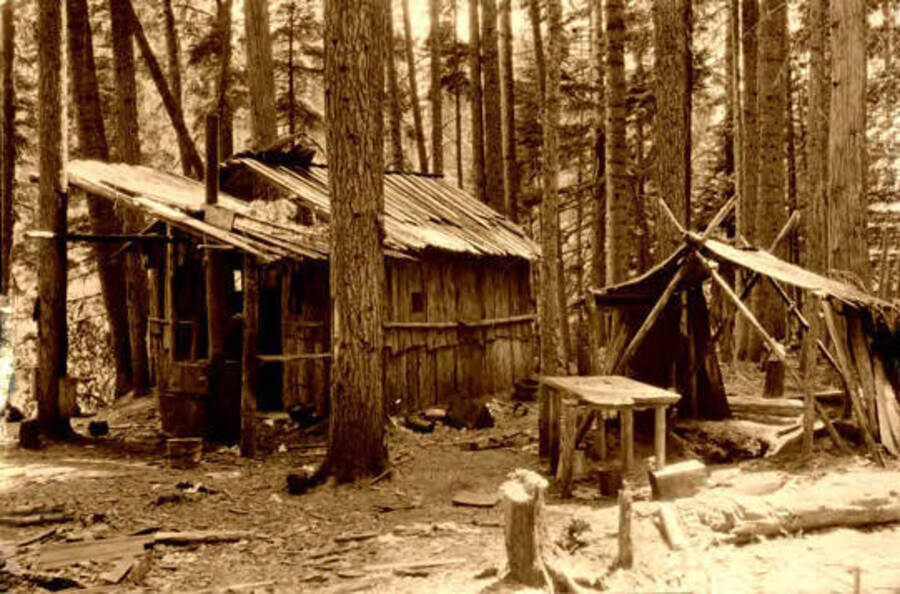 View of a crude wooden structure at a hunter's camp. Donated by Harriet (Klein) Allen via Priest Lake Museum.
