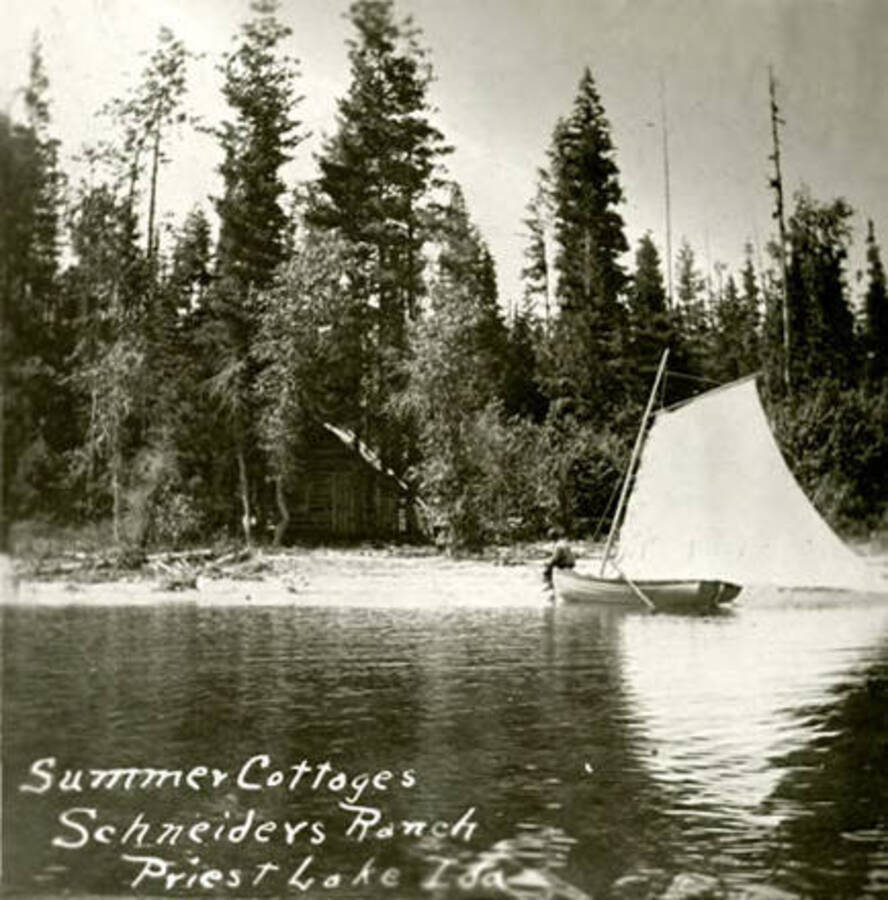 View of Schneider's ranch and summer cottages. Priest Lake, Idaho. Donated by William Warren through Priest Lake Museum.