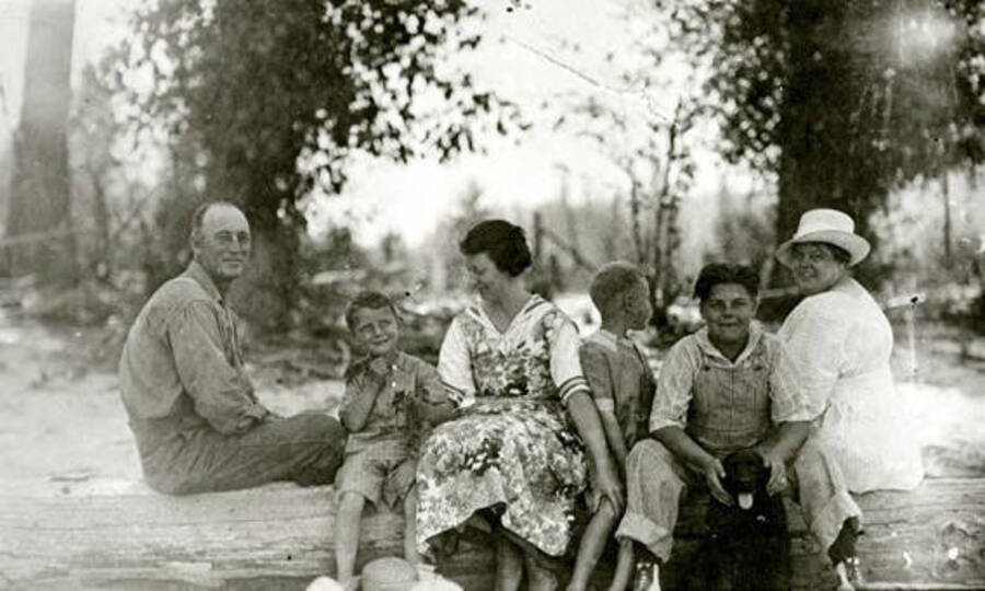 The Warren family sitting on the beach at Priest Lake, Idaho. Donated by William Warren through Priest Lake Museum.