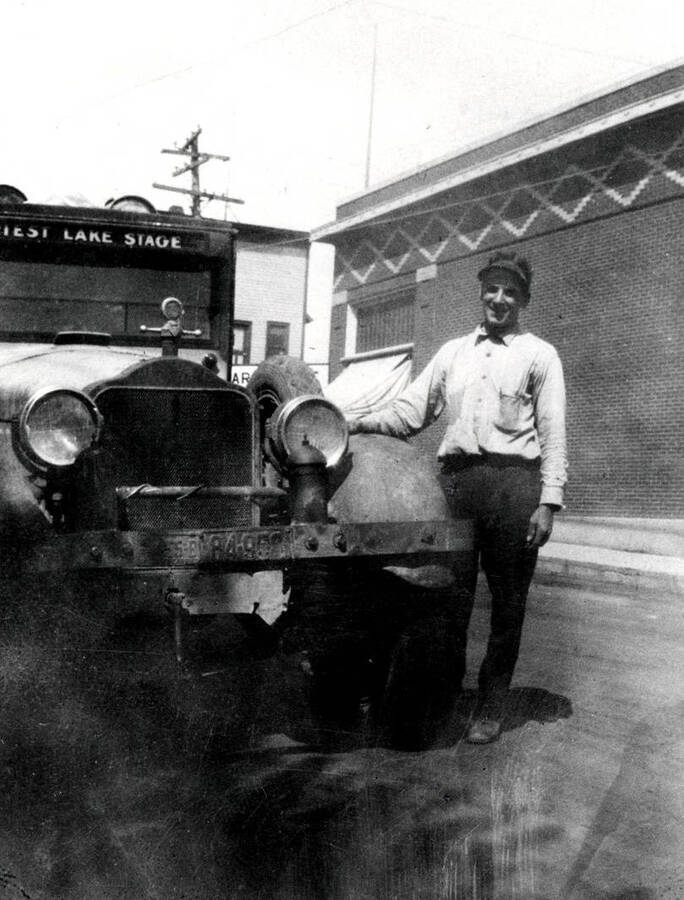 Dewey Huot posing with the Priest Lake Stage automobile.
