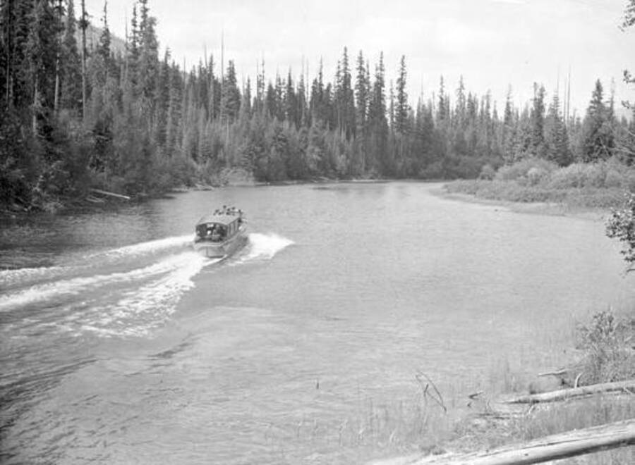 Kaniksu (boat) going up the Thorofare River which joins Priest Lake and Upper Priest Lake. Donated by Ivan Painter through Priest Lake Museum.
