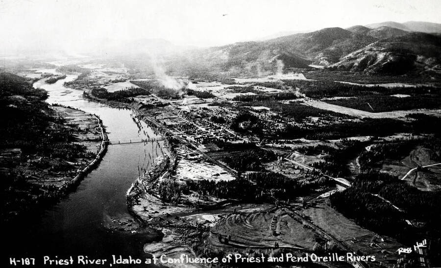 Aerial view of the confluence of Priest River and Pend Oreille River. Print of Ross Hall postcard.