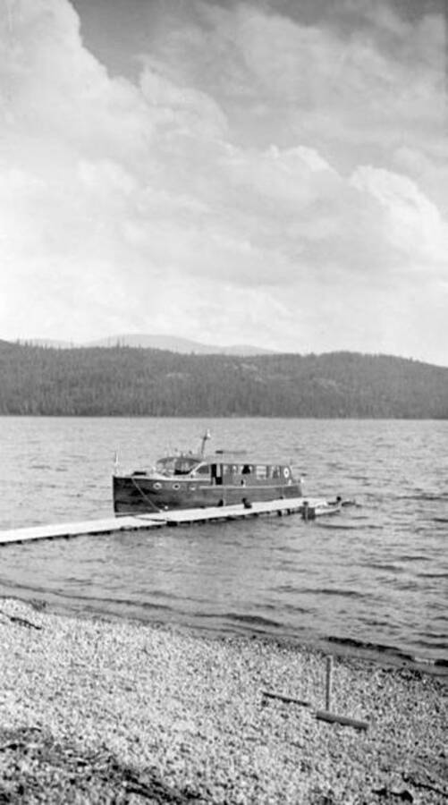 Lady of the Lake [boat] docked. This boat was owned by Carl Warren. Donated by Mary Hunt through Priest Lake Museum.