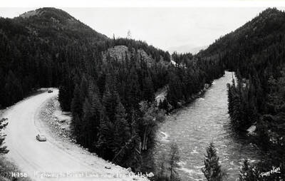 Priest Lake Highway near the Outlet. Print of Ross Hall postcard