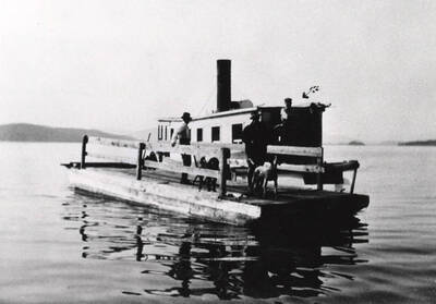 Steamboat W. W. Slee alongside a barge. Donated by Harriet (Klein) Allen through Priest Lake Museum.
