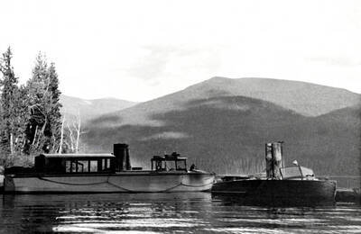 View of the boats Kaniksu and Pend O'Reille tied up at the Beaver Creek dock. Priest Lake, Idaho.