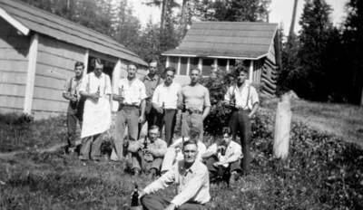 Celebration at Beaver Creek Ranger Station after the repeal of prohibition. Pictured: Ryder Chronic, Frank Wilson, Don Jenkins, Kenneth Nelson, Bill Blake, Henry Deiner, Ivan Painter, Elmer Berg, Tom Spurgeon, unknown, Mark Hurd. Priest Lake, Idaho. Donated by H. J. Deiner through Priest Lake Museum.