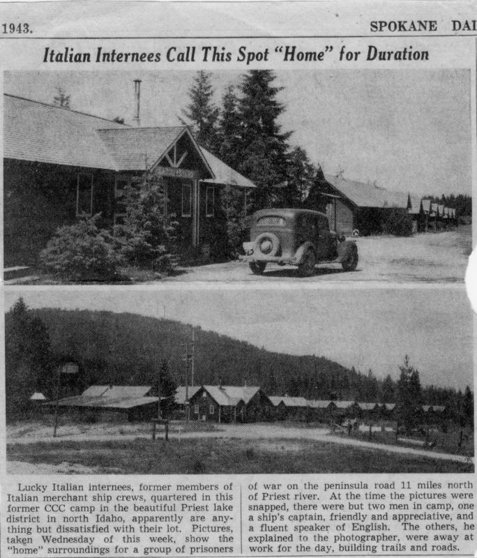 A building with a triangular roof, surrounded by trees, with a car parked nearby. Below, there is a group of buildings in a clearing with a forested hill in the background. The text describes Italian internees living in a former camp in North Idaho during 1943. Text reads: "Italian Internees Call This Spot "Home" for Duration Lucky Italian internees, former members of Italian merchant ship crews, quartered in this former CCC camp in the beautiful Priest lake district in north Idaho, apparently are anything but dissatisfied with their lot. Pictures, taken Wednesday of this week, show the "home" surroundings for a group of prisoners of war on the peninsula road 11 miles north of Priest river. At the time the pictures were snapped, there were but two men in camp, one a ship's captain, friendly and appreciative, and a fluent speaker of English. The others, he explained to the photographer, were away at work for the day, building trails and roads."