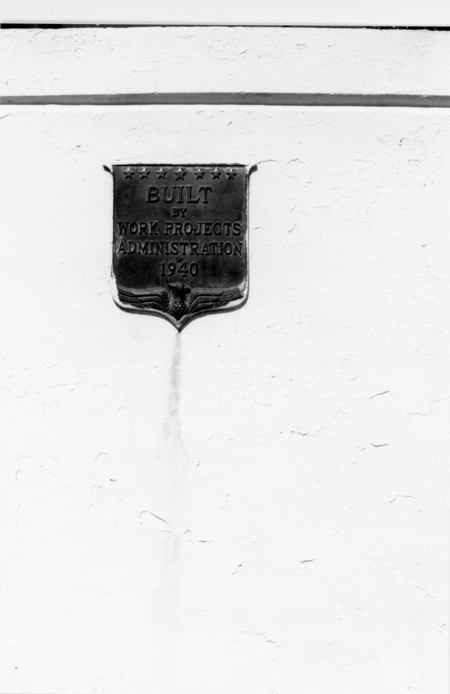 A plaque on a wall displaying the text "Built by Work Projects Administration 1940" with an eagle design at the bottom.