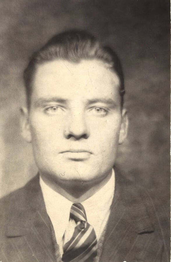 Portrait of Stephen Bern Dahlman, artist and illustrator for Psychiana, wearing a suit and tie.