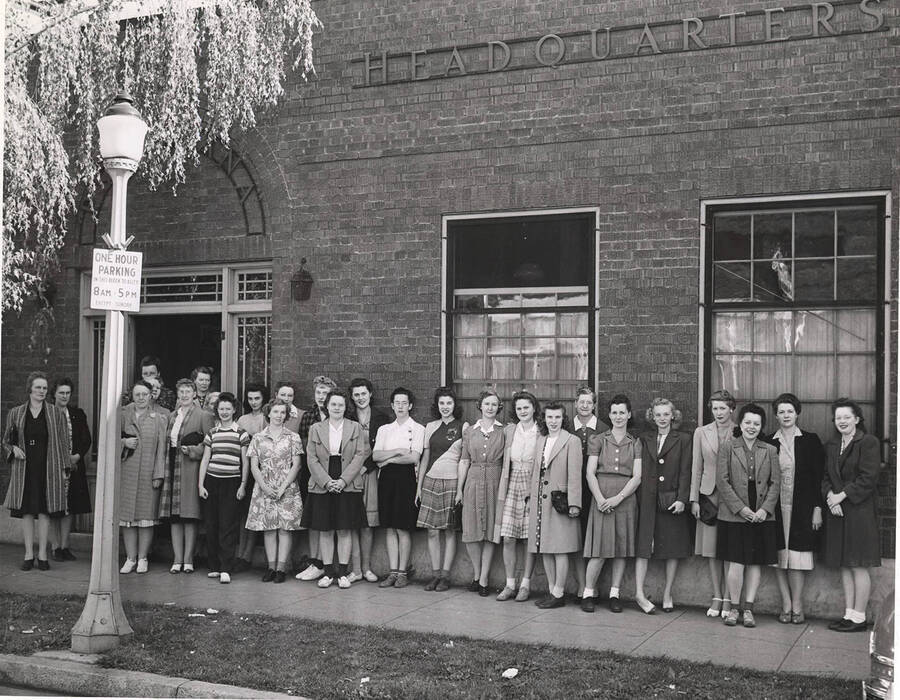 Photograph of all women staff standing in front of Psychiana's International Headquarters, which operated with a staff of sixty-three women who conducted a direct mail campaign.