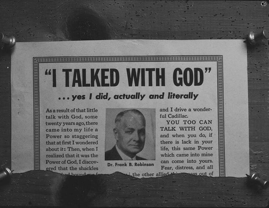 Photograph of Psychiana Advertisement pinned to a board, reads 'I TALKED WITH GOD...'
