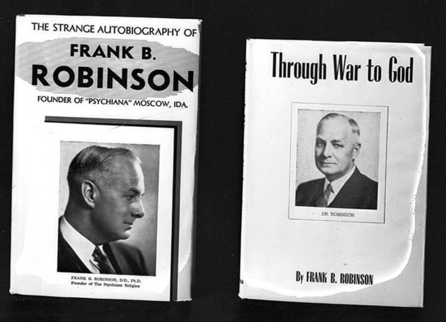 Negative photograph of Frank B. Robinson's autobiography, The Strange Autobiography of Frank B. Robinson, alongside his book, Through War to God. Both covers include a portrait photograph of Robinson.