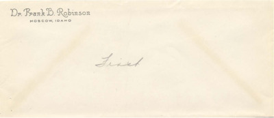 An unaddressed envelope with the preprinted return address of Dr. Frank B. Robinson, Moscow, Idaho. 'First' is written on the envelope in pencil.