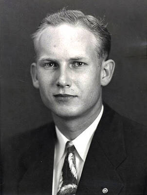 Portrait depicts Alfred B. Robinson, adult, in a suit and tie.