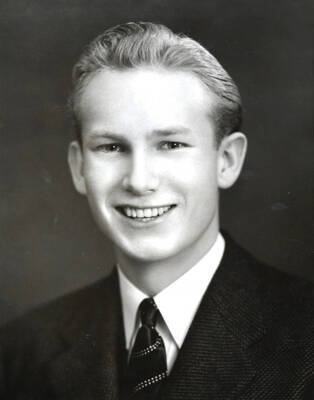Portrait depicts Alfred B. Robinson, age 18, in a suit and tie.
