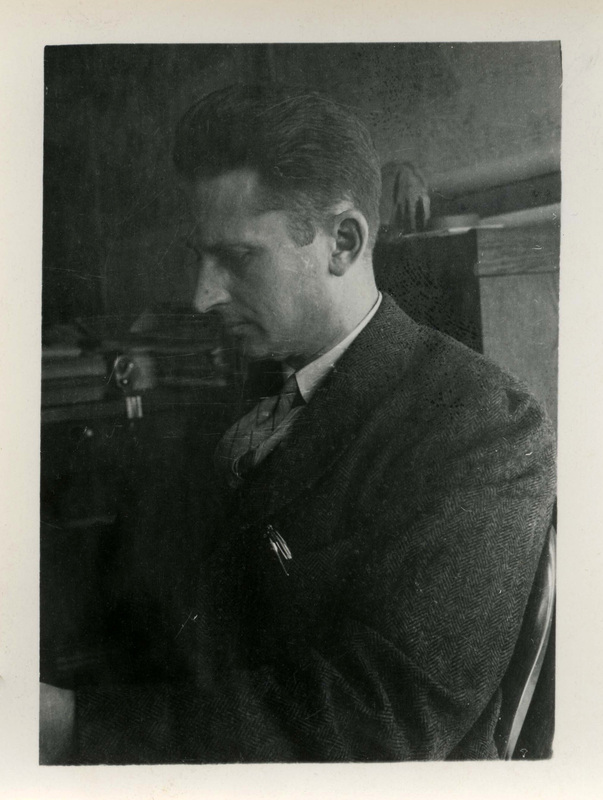 Prof R.K. Pierson, Silviculturist professor in the School of Forestry, seated in an office, looking down away from the camera.