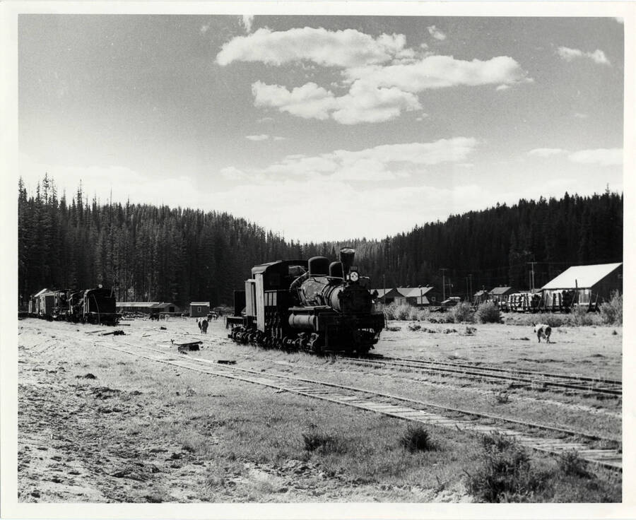 A photograph of a retired train engine at the west end of the train yard in Headquarters, Idaho.