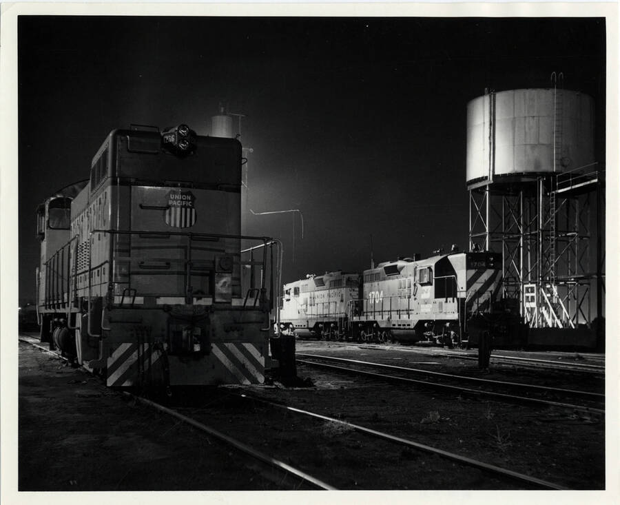 A photograph of train engines U.P. SW-10 #1236, U.P. GP-9 #248, and B.N. GP-9 #1704 on the spot at 10:00 p.m. at the East Lewiston Train Yards.