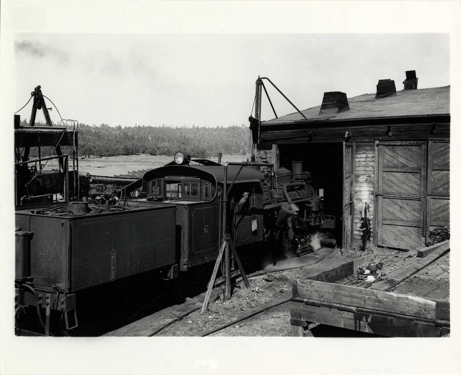 A photograph of train engine Heisler #6 tying up at engine house after taking a couple of cars of lumber to the Camas Prairie R.R. interchange at Craig Junction.