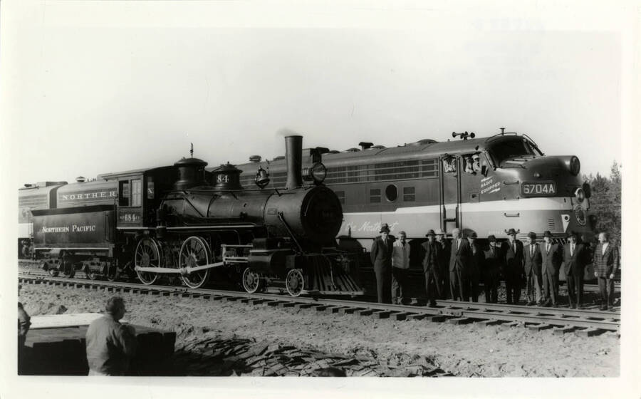 Northern Pacific Engine 684 during a showing, where several men were present to admire said engine for her beauty.