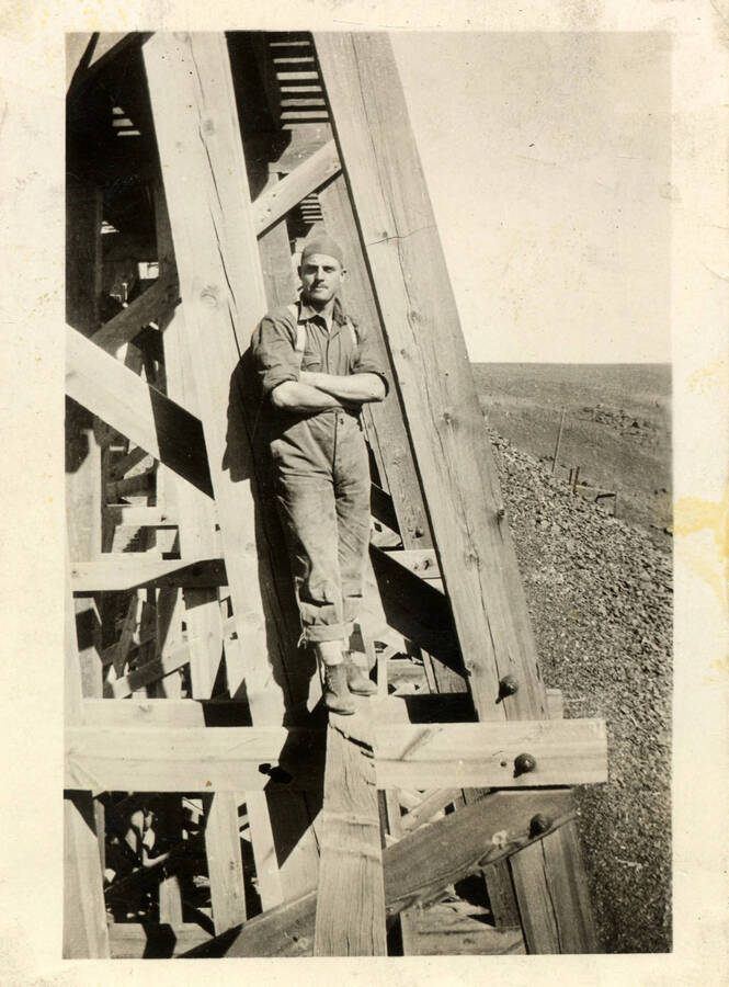 A man stands on the scaffolding of Bridge 46.