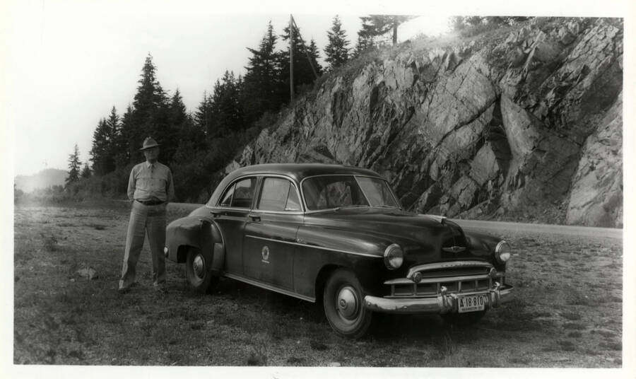 A photograph of either Ron Nixon or Don Colby posing with a nice company car. Excerpt from Ron Nixon: "It was several days later before 684 was ready to be moved from Craigmont to Lewiston, so this time I had time to make arrangements for a company car beforehand. Also decided to take retired Division Superintendent Don Colby along with me as he was very much of a railfan and one of my best friends. He often went with me on picture-taking trips. When he was superintendent at Missoula he would often take me places in his private car, which was pretty darn nice."