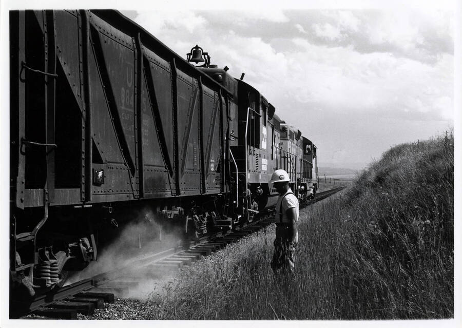 A photograph of Train 858 spreading ballast heading East of Cottonwood.