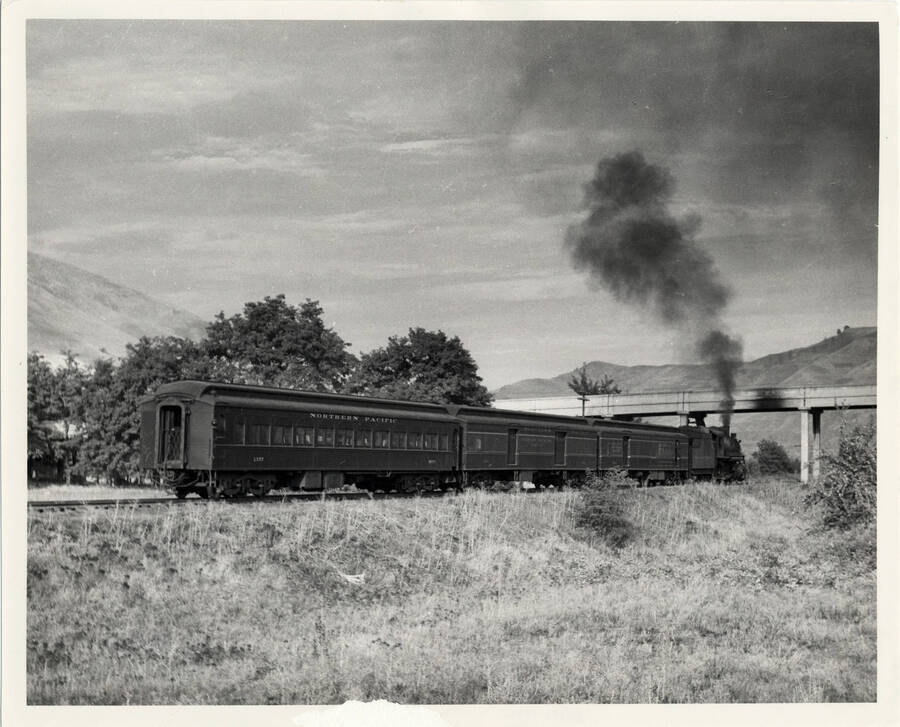 A photograph of Passenger Train #314 heading up the Clearwater River Valley for Spokane.