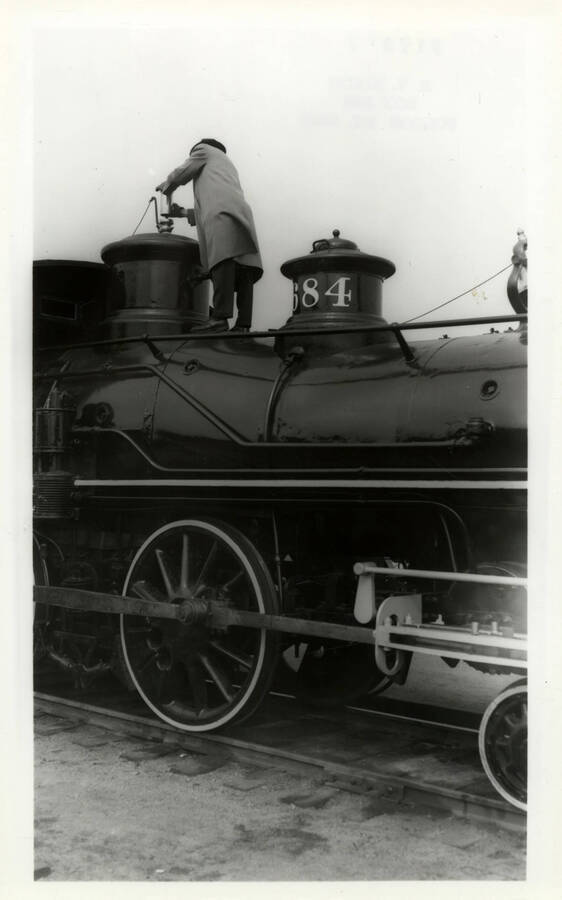 Mr. Radford readying the bell for engine no. 4 to be on display and open to the public for admiration. The whistle was removed after each showing to prevent further thievery.