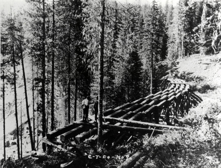 A photograph of several construction workers building the beginnings of a railroad.